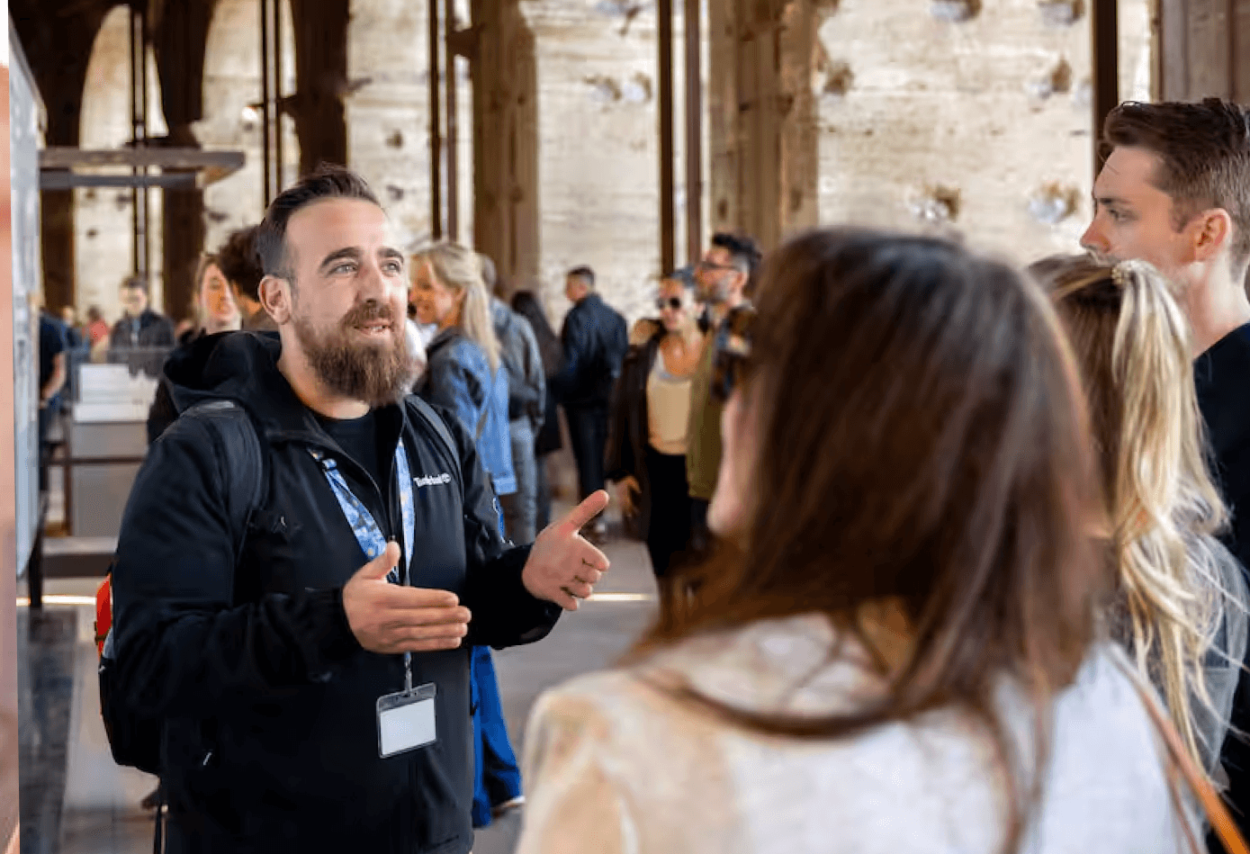 Augustine sharing stories with visitors